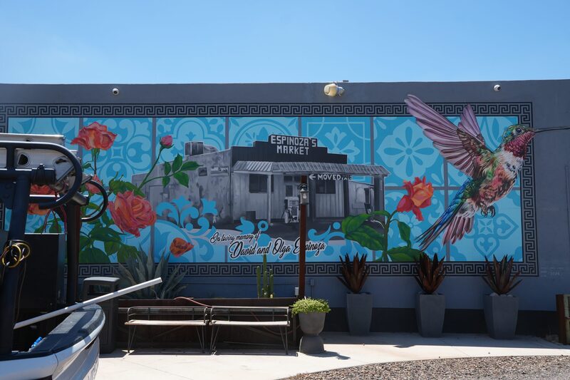 Mural of the original Espinoza's Market with a hummingbird painted beside it