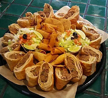 A catering tray of mini chimis