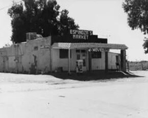 The original Espinoza's Market building in a vintage black and white photograph
