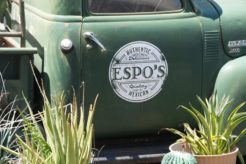 Vintage green Chevrolet truck with the Espo's badge painted on the door