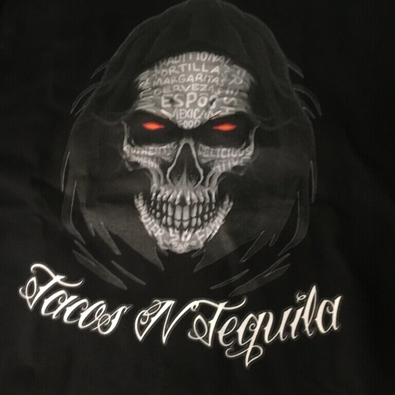 A black shirt with a skull on it